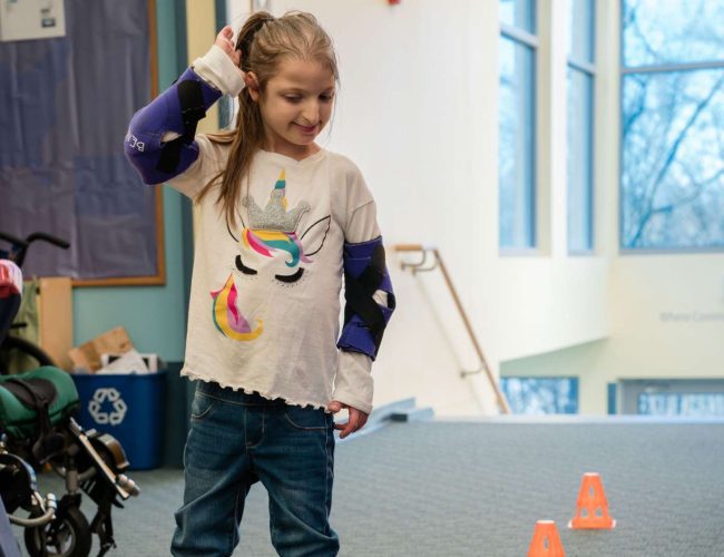 Student playing with a ball